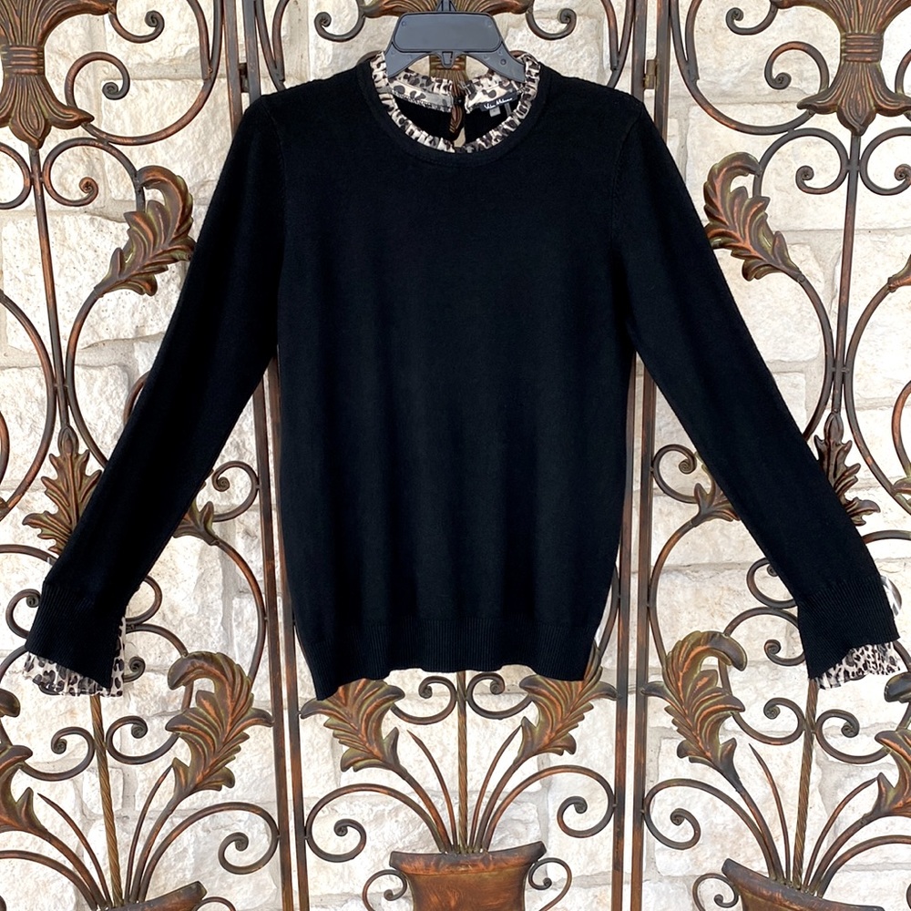 Black pull-over sweater with animal print trim. key hole/button in back